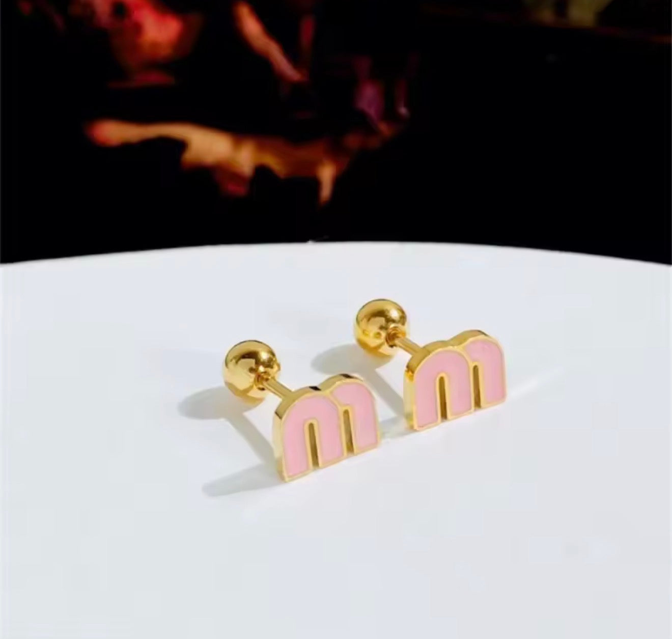M stud earrings